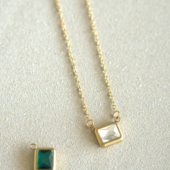 Gold chain necklace and emerald pendant — DYMAN non-tarnish stainless-steel jewelry for everyday wear.